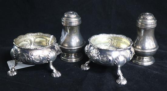 A pair of 1930s silver bun peppers and a pair of George III later embossed silver bun salts, 12 oz.